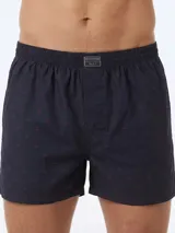 Bóxer negro de algodón liviano, con cintura elastizada y estampado integral de pequeños tractores verdes.