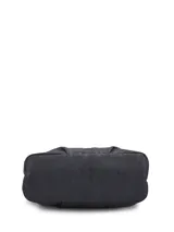 Cartera tote de cuero sintético negro Hush Puppies, con doble asa superior, bolsillos frontales externos y llavero colgante decorativo.