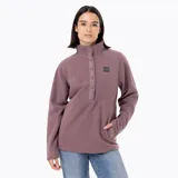 Buzo polar de microfleece color rosa viejo, con cuello alto, cierre frontal parcial con botones a presión y bolsillo frontal tipo canguro. Presenta detalles en nylon en la tapeta y los bolsillos, y puños con sujeción elástica.