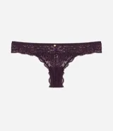Bombacha tipo bikini hilo confeccionada en encaje con diseño floral, presenta un detalle de moña en la parte central de la cintura y laterales medianos.