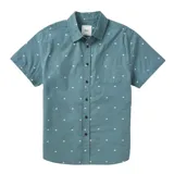 Camisa Katin modelo Balance de manga corta, color verde con estampado de pequeños cuadrados blancos. Cuenta con cuello clásico, cierre frontal con botones oscuros y un bolsillo aplicado en el pecho.