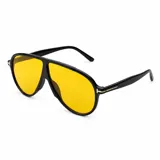 Lentes de sol con armazón de policarbonato negro y diseño de estilo aviador con puente superior plano. Las lentes son de color amarillo y cuentan con filtro UV400. Las patillas incorporan detalles metálicos dorados en las bisagras.