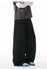 Pantalón deportivo baggy color negro, de algodón, con corte holgado y tiro alto.