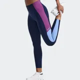 Calza deportiva 2XU modelo Form Spliced Hi-Rise de tiro alto, color azul marino con bandas laterales en contraste de tonos rosado y celeste.