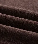 Saco de chenille color marrón, de corte cómodo, con cuello alto y medio cierre frontal, de manga larga y diseño liso.