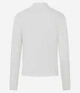 Blusa tipo polo de manga larga confeccionada en algodón, con cuello clásico y cierre frontal de botones. Presenta un diseño de corte regular y acabado suave.