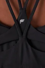 Top deportivo de bajo impacto en color azul marino, con escote redondo y diseño de doble bretel fino. Confeccionado en tejido técnico elástico, ideal para actividades de baja intensidad.