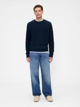 Buzo de punto de algodón con cuello redondo, mangas tipo raglán y puños y ruedo acanalados.