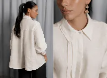 Camisa de lino 100% natural, color blanco, con diseño de doble cuello, cartera escondida y dos tablas frontales que aportan movimiento. Presenta un corte holgado con mangas largas y puños.