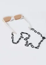 Correa para lentes con eslabones rectangulares de carey y eslabones redondos plateados.