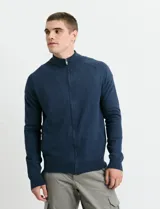 Cardigan de algodón con cuello alto y cierre frontal completo. Presenta mangas largas tipo ranglan y bolsillos laterales de ribete.