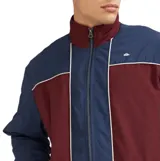 Campera Quiksilver modelo Isla, con diseño de bloques de color en azul y bordó, cierre frontal completo, cuello alto y puños elásticos.