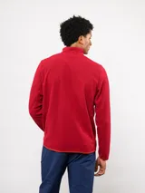 Buzo de micropolar azul con medio cierre frontal, cuello alto y bolsillo con cierre en el pecho. Presenta el logo de Umbro y el escudo del Club Nacional de Football.