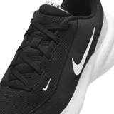 Championes Nike Uplift SC, color negro con detalles en blanco y gris. Presentan una parte superior de textil transpirable, entresuela de espuma para amortiguación y suela de goma para tracción.