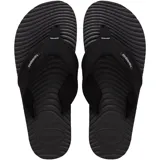 Ojotas Havaianas Surfer Coast, color negro, con tiras de tela texturizada y suela con diseño ondulado.
