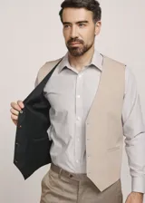 Chaleco reversible Due Volti de corte sastrero, con diseño a cuadros en tonos de gris y cierre frontal con cuatro botones oscuros.