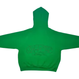 Canguro verde con capucha, corte oversize y estampado en la espalda con la palabra "Ferxxo" en tipografía estilo graffiti y la frase "Montevideo 2023".