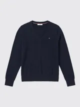 Sweater Tommy Hilfiger de cuello en V y manga larga, confeccionado en algodón orgánico. Presenta un diseño liso en color azul marino con el logo de la marca bordado en el pecho.