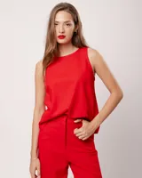 Musculosa blanca de lino con escote redondo y corte a la cadera.