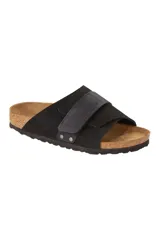 Sandalias Birkenstock Kyoto negras con hebilla ajustable y plantilla anatómica de corcho y látex. Capellada de cuero nobuck y suela de goma EVA.
