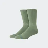Medias de caña media color verde oliva, con tejido acanalado en la parte superior y logo bordado en el lateral.
