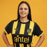 Camiseta de fútbol Puma del Club Atlético Peñarol, modelo Home. Diseño a rayas verticales amarillas y negras, con cuello redondo, mangas cortas y logo de la marca y escudo del club en el frente.