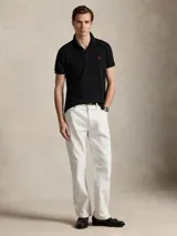 Remera polo de algodón color rosado, corte Custom Slim Fit, manga corta y cuello con botones. Cuenta con el logo bordado en el pecho.