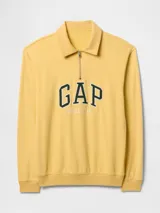 Buzo deportivo de algodón color amarillo, con cuello polo y cierre frontal parcial. Presenta el logo de la marca estampado en el pecho con letras grandes en color verde y la palabra 'Athletic' bordada debajo.