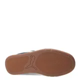 Championes urbanos Puma modelo Park Life Style SK8, color negro con detalles en blanco. Presentan un diseño de corte bajo con capellada de gamuza sintética, suela de goma en tono crema con base marrón y cierre mediante cordones.