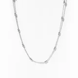 Collar plateado fino con cadena de eslabones y pequeñas bolitas distribuidas a lo largo de la cadena.