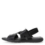 Sandalias de cuero marrón con tiras cruzadas y cierre de velcro en el talón, montadas sobre una suela ergonómica negra.