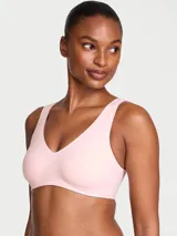 Bralette inalámbrico de doble capa color rosado, con escote en V, almohadillas extraíbles y diseño sin costuras ni herrajes.