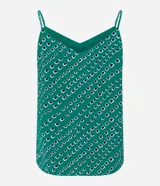 Blusa de crepe verde con estampado geométrico en blanco y negro, escote en V y tirantes finos.