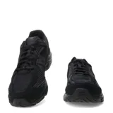 Championes New Balance modelo 509, color negro, con capellada de malla y superposiciones de gamuza. Presenta el logo 'N' en el lateral y detalles de amortiguación visibles en el talón.