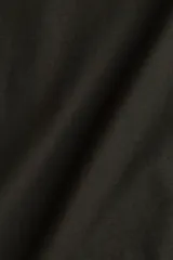 Musculosa cropped color negro, de punto suave de algodón, con corte holgado, escote en U y bajo recto.