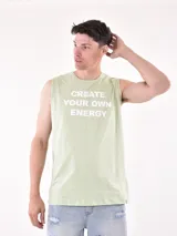 Musculosa verde claro con estampado frontal con la frase "Create Your Own Energy" en letras blancas.