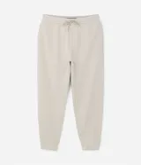 Pantalón tipo jogger de corte holgado, color verde oliva, con cintura elástica ajustable mediante cordón, bolsillos laterales y puños elásticos en los tobillos.