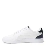 Championes Puma modelo Shuffle, de diseño urbano con silueta de bota baja. Presentan una parte superior de cuero sintético negro con la clásica franja lateral de la marca en color blanco y logo dorado. Incluyen plantilla SoftFoam+ para mayor amortiguación, cierre con cordones y suela de goma blanca.