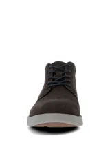 Botas de estilo casual Hush Puppies, confeccionadas en cuero gamuzado color gris oscuro. Presentan cierre de cordones, suela de poliuretano con tecnología Spinal para mayor amortiguación y estabilidad, y sistema de plantilla Dual Fit.