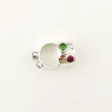 Anillo ancho de plata 950 con seis circonias engarzadas de colores.