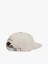 Gorra de béisbol Tommy Jeans confeccionada en tejido ripstop color beige, con visera plana y parche con logo de la marca en la parte frontal.