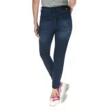 Jeans skinny de denim azul índigo con efecto lavado y roturas sutiles, de corte ajustado y tiro medio.