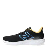 Championes de running New Balance, color negro con detalles en azul y amarillo.