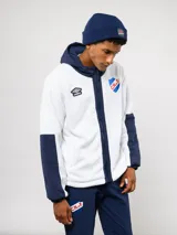 Campera de polar blanca con capucha y detalles en azul marino, con cierre frontal completo. Presenta el logo de Umbro y el escudo del Club Nacional de Football en el pecho.