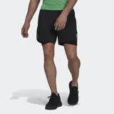 Short Adidas de hombre color negro con calza interior y logo de la marca en verde flúor. Incorpora tecnología transpirable Aeroready y detalles reflectantes.