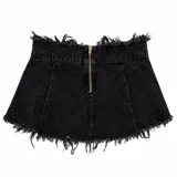 Conjunto de dos piezas compuesto por un chaleco tipo corset de denim lavado con cierre frontal de argollas metálicas y una minifalda de denim con diseño plisado, bordes deshilachados y correas laterales con hebillas.