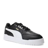Championes urbanos Puma modelo Shuffle Downtown, de diseño clásico con exterior en cuero sintético negro, franja lateral blanca y suela de goma blanca. Incluye logo de la marca en dorado en el lateral.