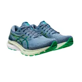 Championes de running Asics Gel-Kayano 29, color negro con detalles en rojo y amarillo. Presentan tecnología FF Blast+ en la entresuela para mayor amortiguación y diseño de malla transpirable.