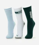 Pack de tres pares de medias de caña larga marca Puma, confeccionadas en algodón suave y respirable. El set incluye un par celeste, un par blanco con detalles en verde y un par verde oscuro, todos con el logo de la marca estampado.
