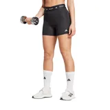 Calzas cortas deportivas Adidas Techfit, color negro, ajustadas al cuerpo con cintura elástica ancha que lleva el logo de Adidas y la palabra "TECHFIT" repetida. Presenta el logo de Adidas impreso en blanco en la pierna izquierda.